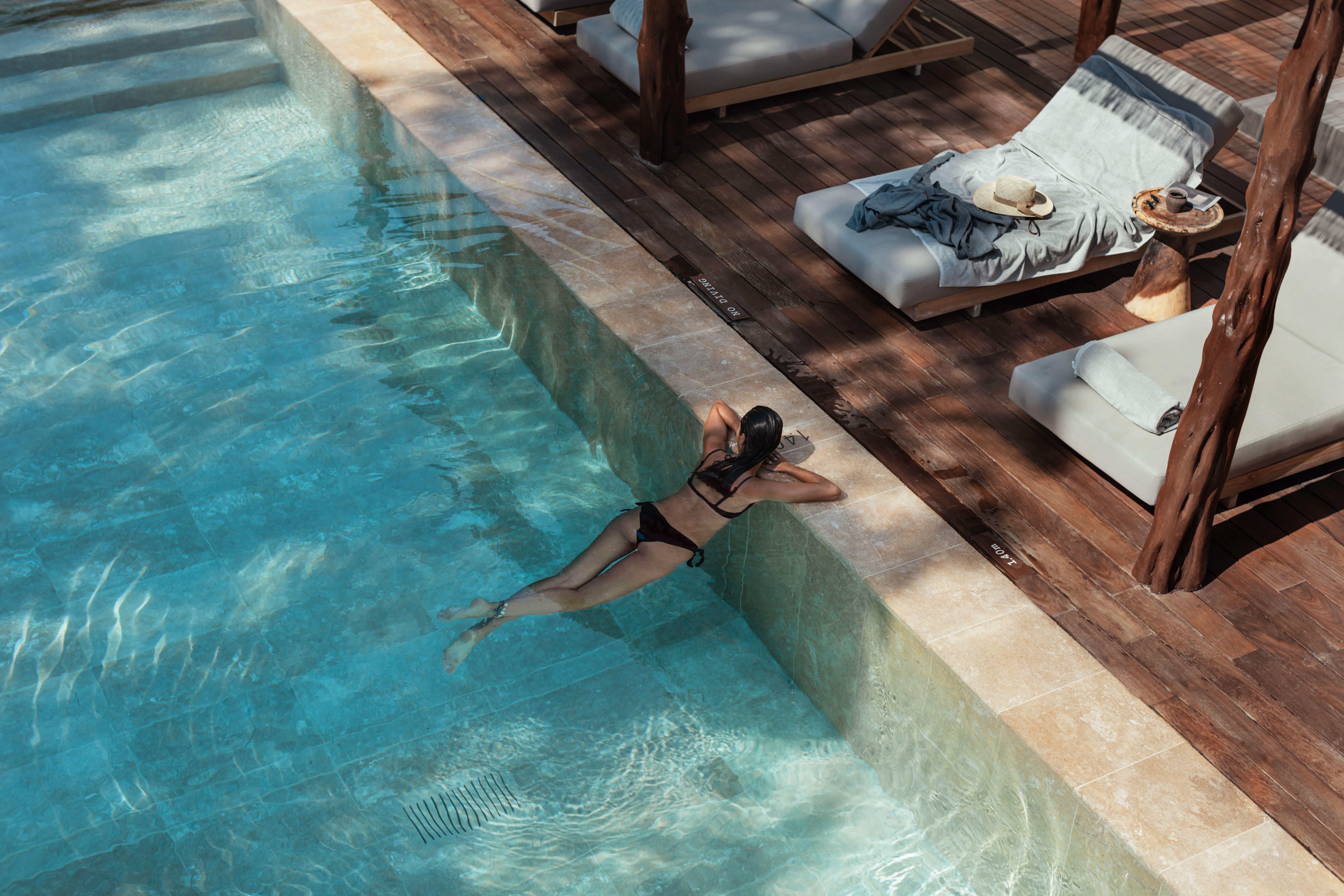 Oku Ibiza (Adults Only) Hotel San Antonio  Bagian luar foto A woman swimming in a pool