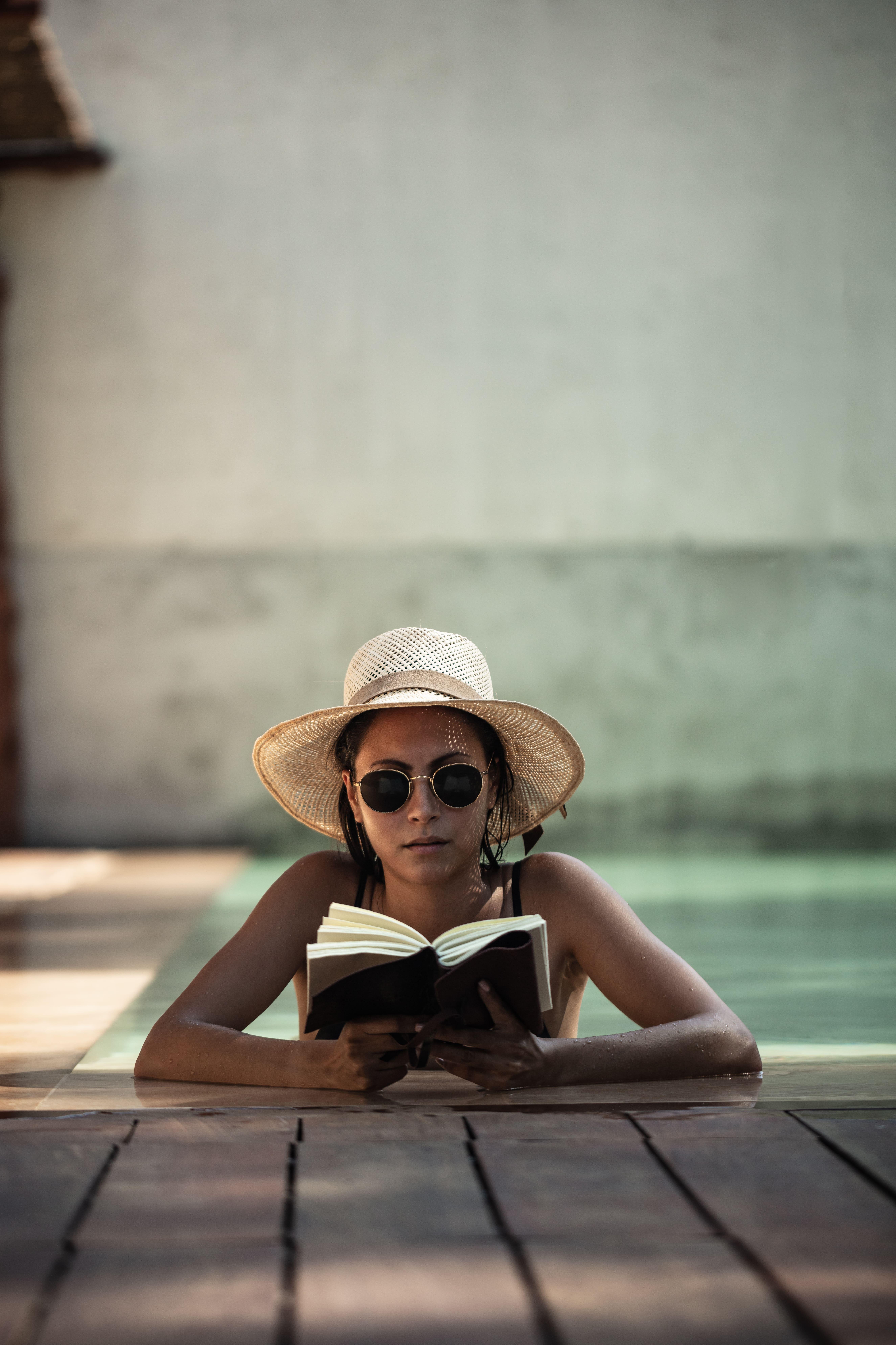 Oku Ibiza (Adults Only) Hotel San Antonio  Bagian luar foto A woman wearing a hat