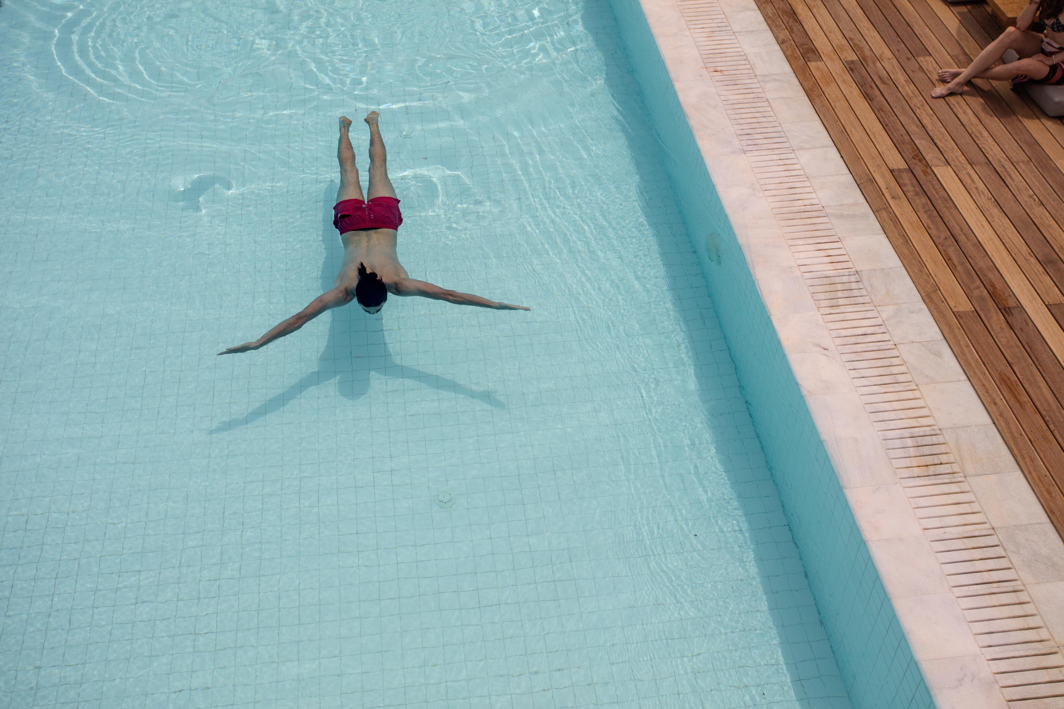 Oku Ibiza (Adults Only) Hotel San Antonio  Bagian luar foto A man floating in a swimming pool